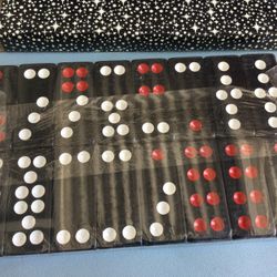 $$20.00.. 32 Piece Domino Set. Black. In Regular Cardboard Box. Set Is Still Plastic Sealed. Pick Up South Gate