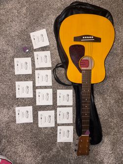 FG- Junior Acoustic Guitar + strings