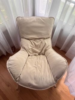 Cream cozy rocking lounge chair