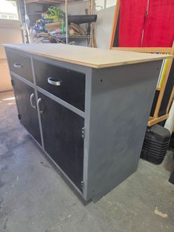 Cabinet with drawers.