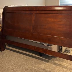 King size bed.  Dark oak.