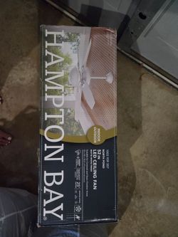 White Hampton Bay ceiling fan with light