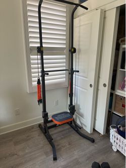 Assisted pull up and dips machine