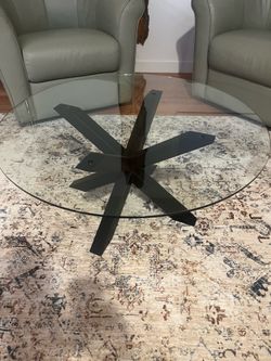 glass top coffee table. approx 2 ft high and 36" diameter of the glass.