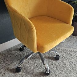 Yellow swivel desk chair 