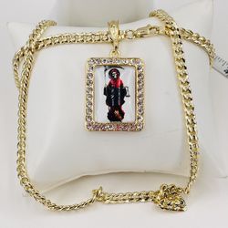 La Santa Muerte y Cadena oró laminado 14k/the grim reaper and 14k gold plated chain