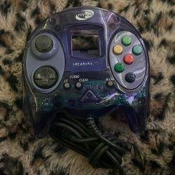 This is a Nyko Dream Master wired controller in clear purple for the Sega Dreamcast console