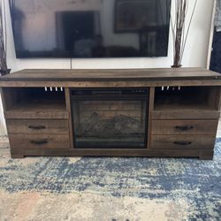 Ashley Trinel Tv Stand W/ Fireplace And Coffee Table