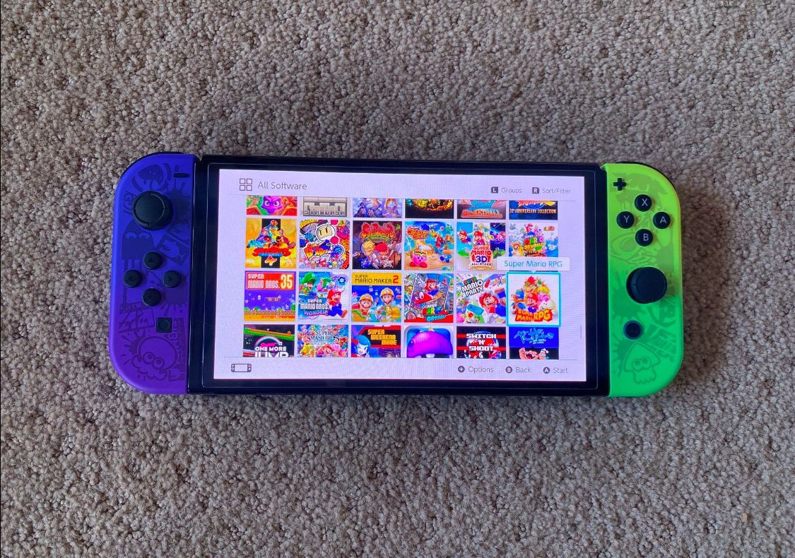 Nintendo Switch OLED + 100 SWITCH GAMES and 7000 RETRO Games