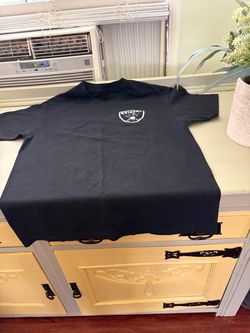 Raiders black short-sleeve tee with small NFL team logo on the left chest. Simple crew neck and classic fit. Easy to wear for gameday or casual outing