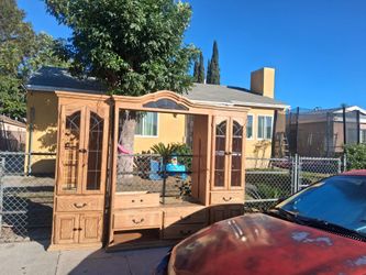 T v entertainment center with two shina cabinets on side