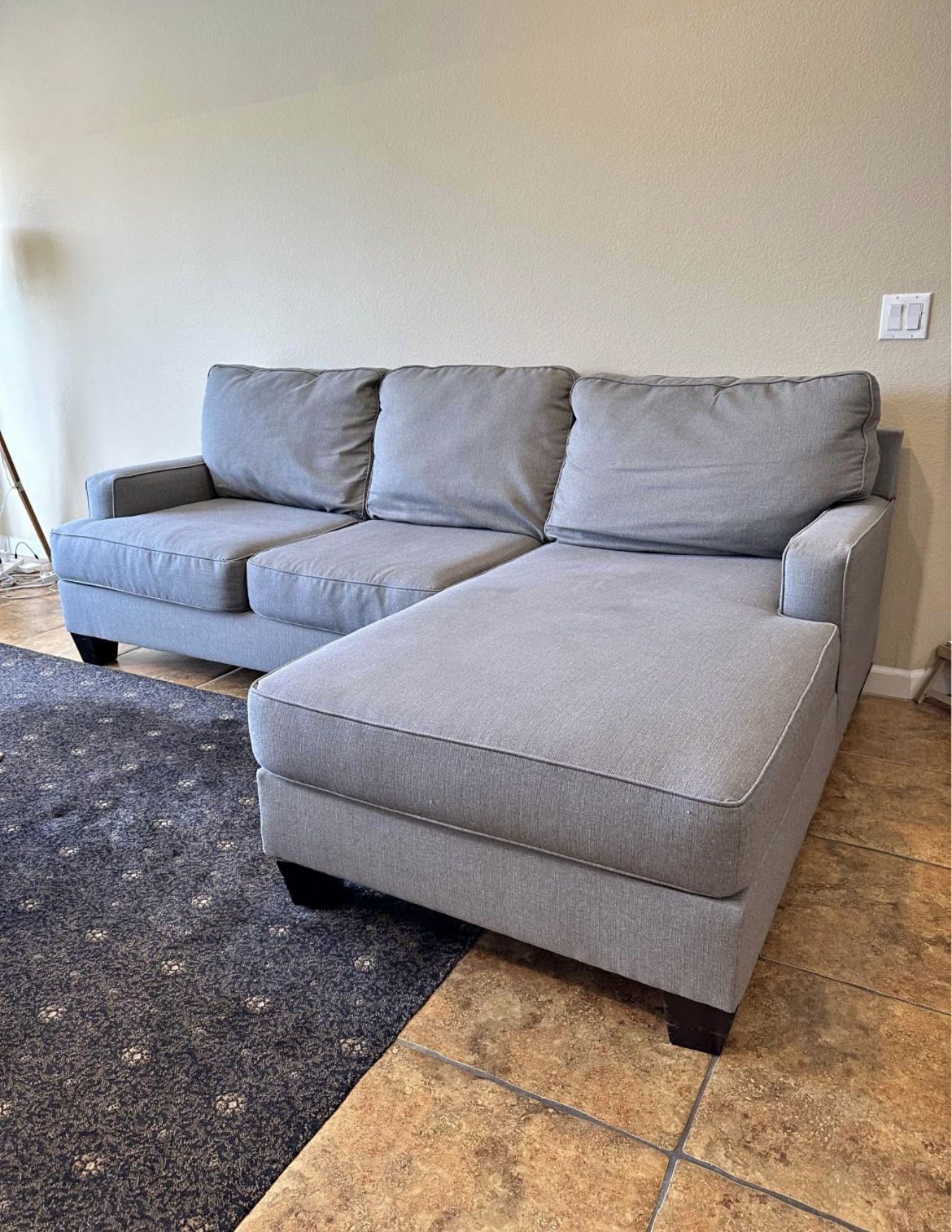 Ashley’s Gray Sectional Sofa Couch with right facing chaise