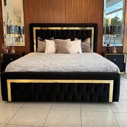 Queen size bed upholstered with gold accents