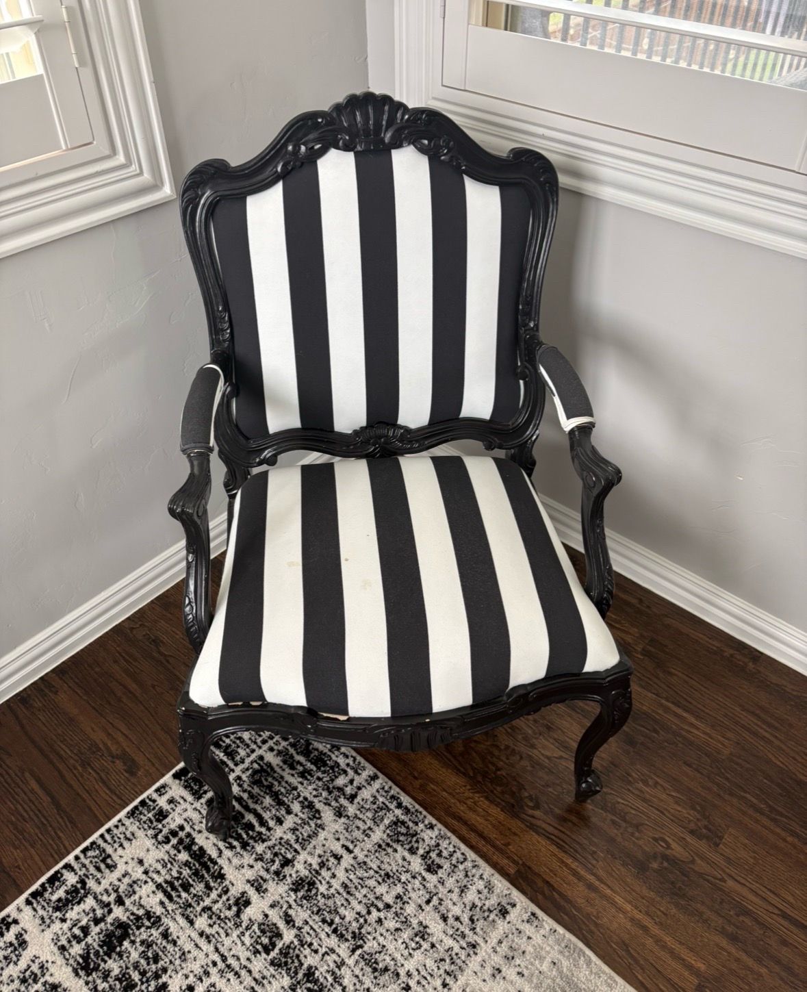 Elegant set of 2 reupholstered accent chairs featuring a bold black and white striped