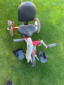 The AmTryke 12 in. (AM-12) STANDARD Special Needs Tricycle is a Hand & Foot Tricycle propelled by th