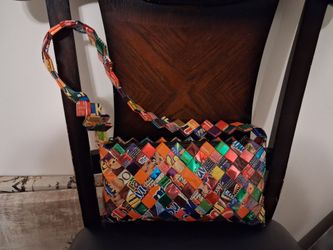 hand-woven handbag made from recycled candy and snack wrappers
