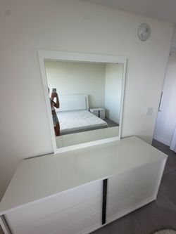 White dresser with a mirror