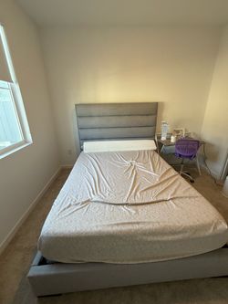 Upholstered queen bed frame and mattress