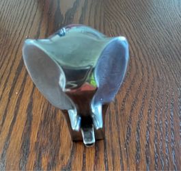 Silver lined zink paperweight.
