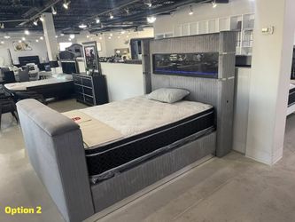 Upholstered bed with fireplace display features TV lift & over 10 color ambient lighting display