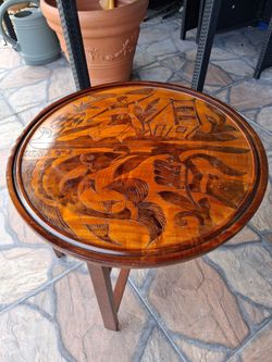 Vintage mid-century Haitian double sided hand carved folding table.  21" Diameter. In Like New Condition