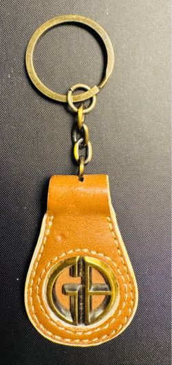 This is a vintage Giani Bernini leather key chain featuring the brand's circular "GB" logo emblem.