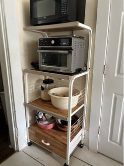 Kitchen storage shelf on wheels.