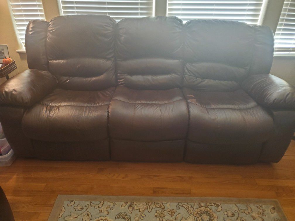 Couch and love seat all recline back and rocks