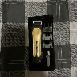 Blade Trimmer And Comes With 3. Comb Guides