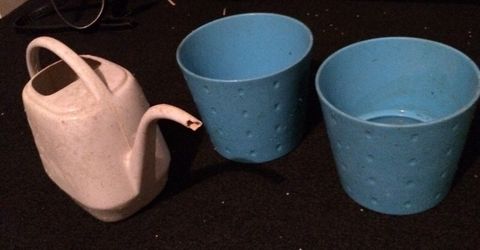 Watering can and two blue ceramic pots