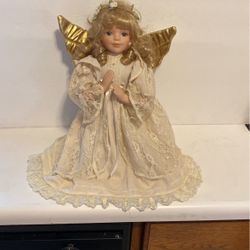 Vintage kneeling angel doll. 13 inches tall.