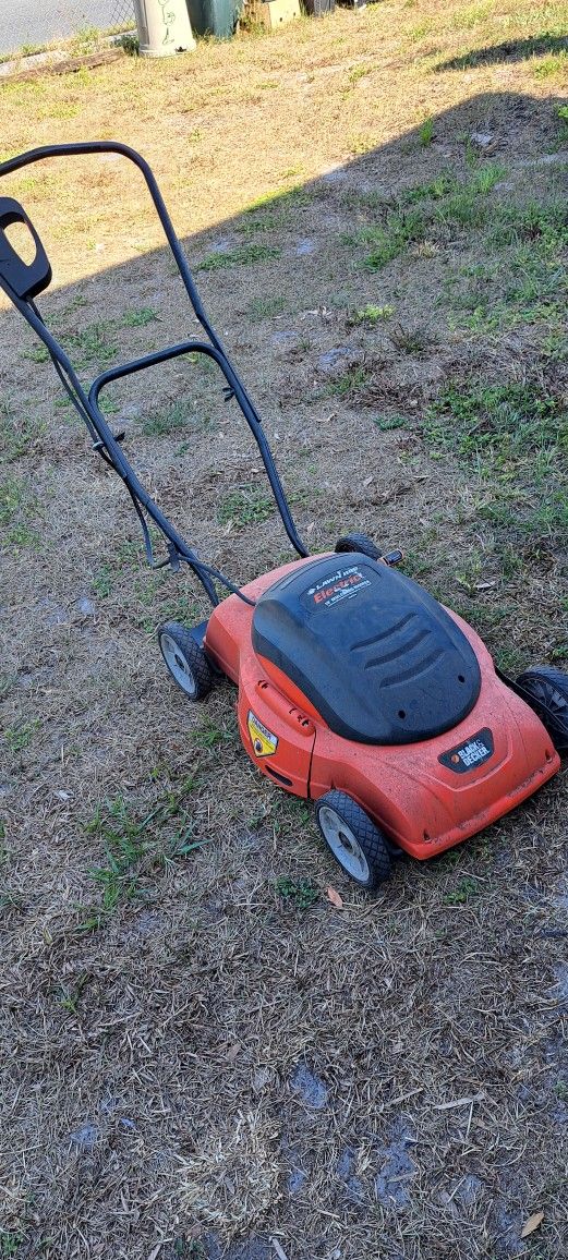 Electric lawn mower by Black and Decker.