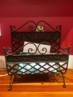 Ornate vintage wrought iron magazine rack