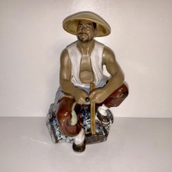 Vintage Man Wearing Hat, Seated With Hammer Glazed Mudware Figurine