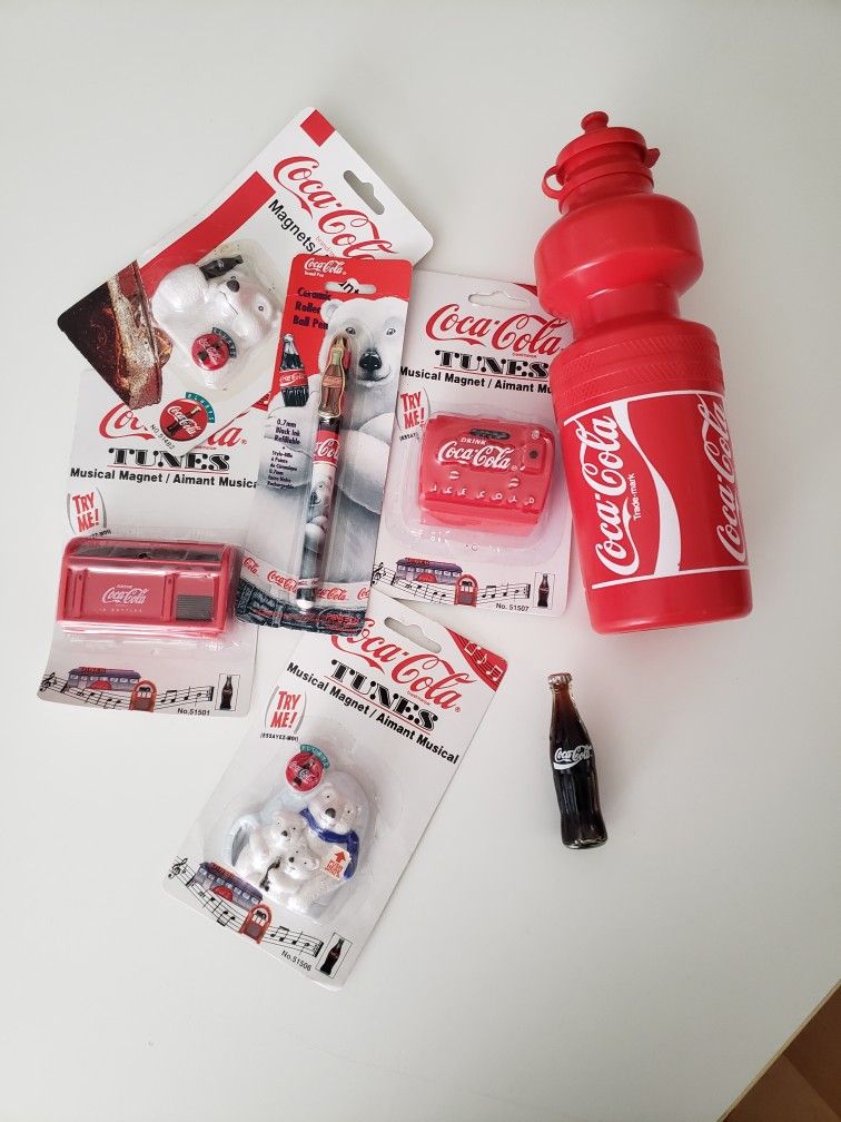 Coca Cola collectables Lot Fridge Magnets, Water Bottle, and Pen
