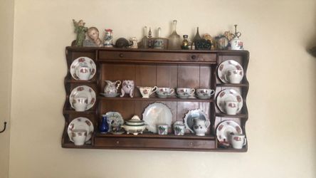 Antique cups and saucers and wooden rack