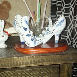 Vintage porcelain shoes, 5” high, embellished with blue, white & gold accents