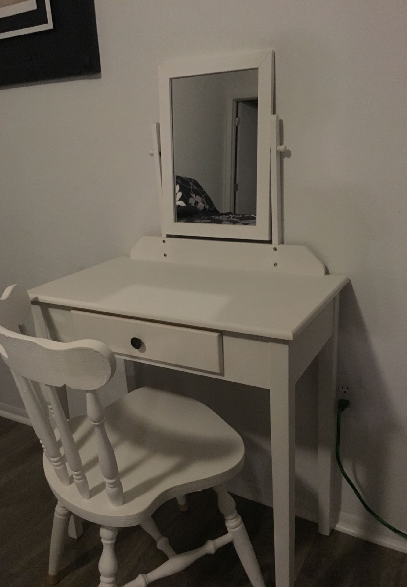 White vanity with mirror and chair