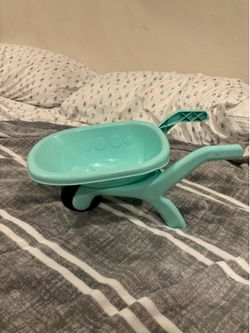 Kids play wheel barrow