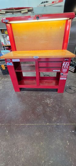 Work Bench by Waterloo. Heavy duty, 1 1/4" table, red,54" X 24" work top.