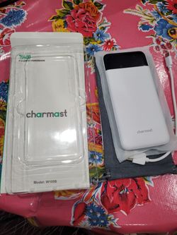 Charmast 10400mAh powerbank model: W1056. 1040mAh Charmast powerbank. Model W1056 white opened box product new with instructions and carrying pouch.