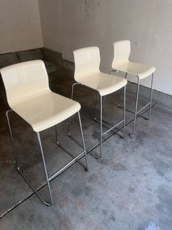 Set of 3 modern white bar stools for sale.