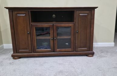 Corner TV stand (also called a corner media console or corner entertainment cabinet)