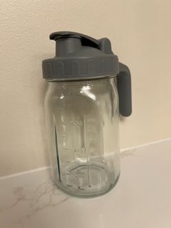 Mason jar with plastic lid and handle