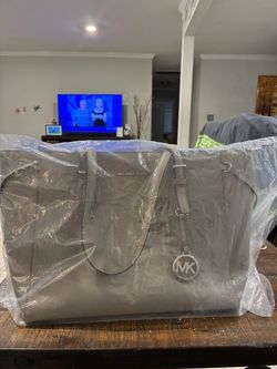 Michael Koors purse. New still in box. Color grey.