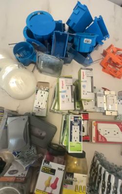 Box of various electronic items. Most of everything is new. Includes gfi plug, light switches, 3 way switches, occupancy sensors, covers, porcelain la
