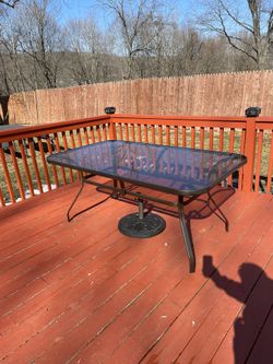 Table with loveseat and 3 chairs