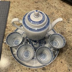 Vintage 1950s–1970s Chinese Rice Grain Porcelain Tea Set  Beautiful blue-and-white porcelain tea set with the classic rice grain pattern and intricate