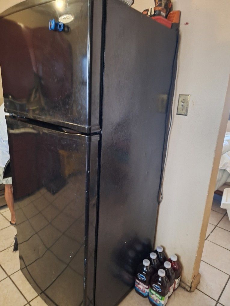 Whirlpool refrigerator black good condition. $75 or best offer