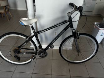 This is a project for you to finish; it is missing the chain and a few other details. The frame is aluminum, and it has good tires.
